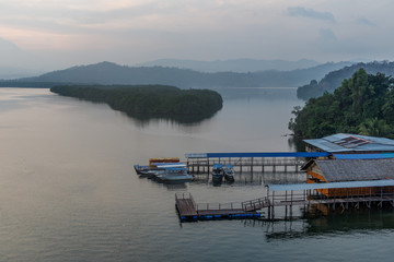 View of Mengkabong River with Boats and Houses in the Morning