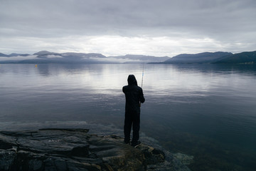 Fototapeta na wymiar Image with a fisherman.
