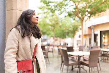 Young indian woman enjoying visiting a new city