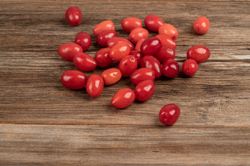 fresh and ripe cranberry fruits on wooden table