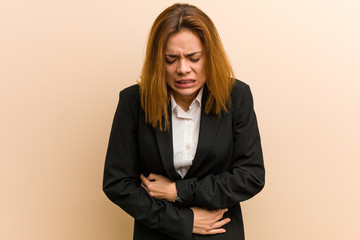 Young caucasian business woman sick, suffering from stomachache, painful disease concept.