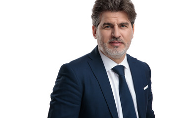 Close up of a senior businessman wearing a blue suit