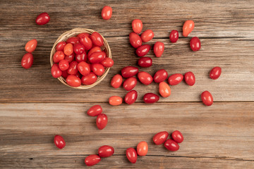 Naklejka na ściany i meble fresh and ripe cranberry fruits on wooden table