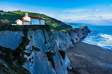 San Telmo chapel on the top of the cliffs overlooking the Atlantic Ocean, Zumaia, Basque Country, Spain.