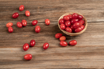 fresh and ripe cranberry fruits on wooden table