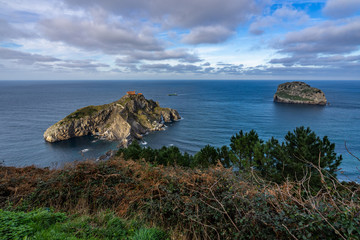 Panoramic view of San Juan de Gaztelugatxe and Aketx (Aquech) island in Atlantic Ocean, Bermeo, Basque Country, Spain