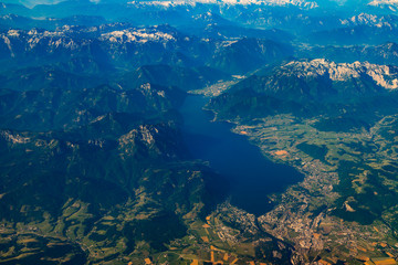 Fototapeta na wymiar Aerial view of mountains lake and village landscape.