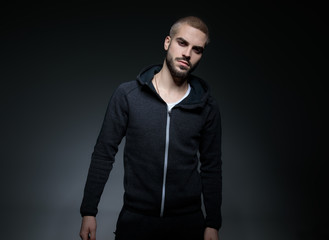 male model wearing hoodie and posing
