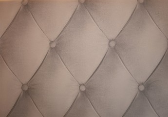 White diamond quilted imitation wallpaper.