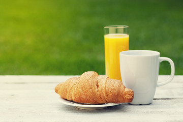 Coffee, orange juice and croissant