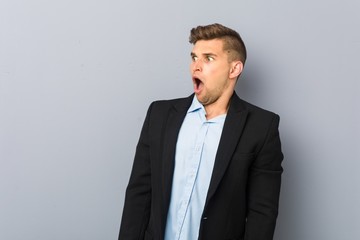 Young handsome caucasian man being shocked because of something she has seen.