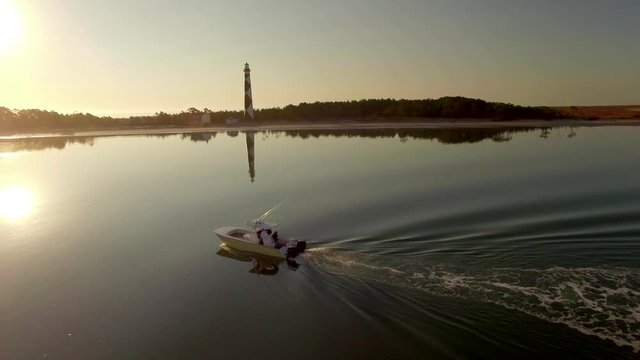 Cat Boat Coasts Across The Crystal Waters Near Cape Lookout in North Carolina, Slow with No Wake. Aerial Shot