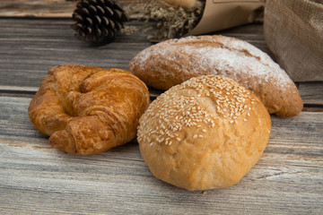 homemade cookies and bread in wooden background
