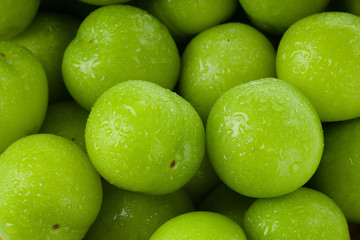heap of green cherry-plum  background