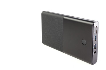 Obraz premium Power bank for charging mobile devices. Black smart phone charger with power bank . Battery bank. External battery for mobile devices.