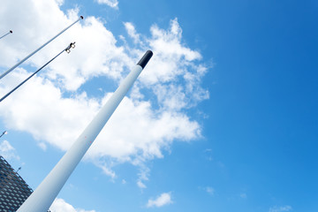 Smokestack against the blue sky. Bottom view Industrial background. Architecture.