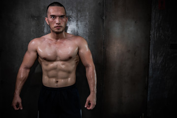 Fototapeta na wymiar Portrait of asian man big muscle at the gym,Thailand people,Workout for good healthy,Body weight training,Fitness at the gym concept