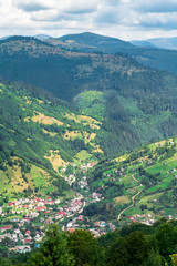 Fototapeta na wymiar small town in the green mountain valley