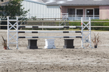 Black and white fence made in wood for horse jumping