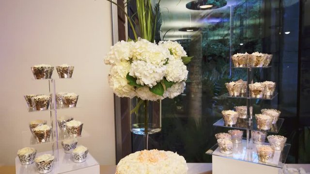 Wedding sweet treats on a beige tablecloth. Wedding dessert 4k