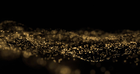 Fototapeta na wymiar Golden glitter splash, light particles wave, golden sparks glow. Glittering light bokeh on black background, overlay effect