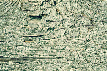 Old peeling paint on a wooden surface. retro wall background.