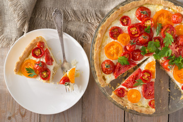 Tomato ricotta tart on wooden table