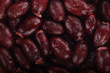 seeds of lychee with water drops background