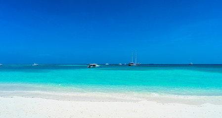 Fototapeta na wymiar Yacht near the pier of a fabulous island in the Maldives.