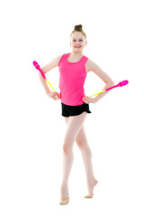 A girl gymnast performs exercises with a mace.