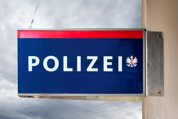 Austrian police sign on a facade, (Police - Polizei)
