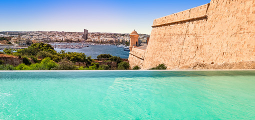 Naklejka premium Infinity pool overlooking the city of Valletta, Malta.
