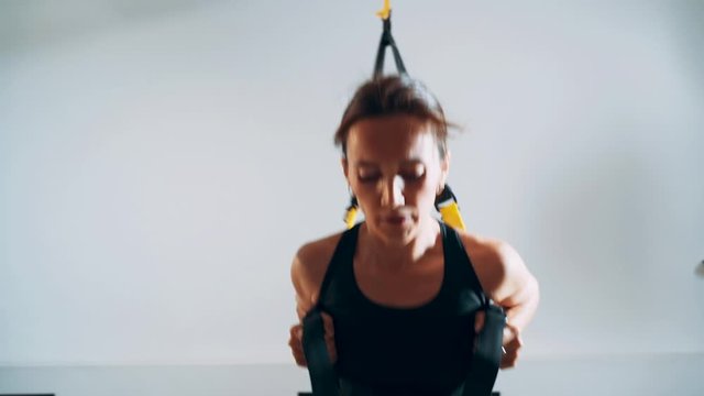 Girls practice with TRX loops.