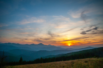 Fototapeta na wymiar Sunset in the mountains in summer
