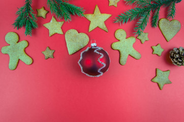 Christmas, New Year's red background. gingerbread. spruce twigs