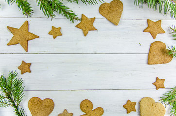 Christmas gingerbread on a white wooden background