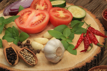 vegetables and spices on wooden background