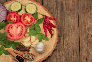 vegetables and spices on wooden background. top view