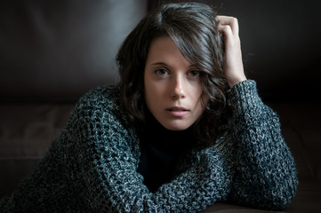 Girl with melancholy attitude photographed at home