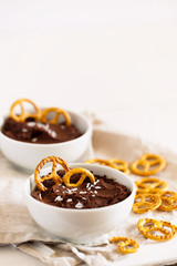 Healthy snack of homemade raw chocolate brownie dessert hummus made with chickpeas,cacao and coconut or almond milk