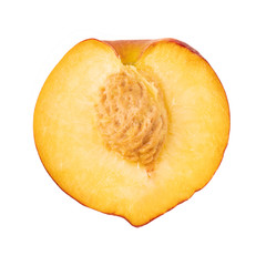 half fresh peach with stone isolated on white background