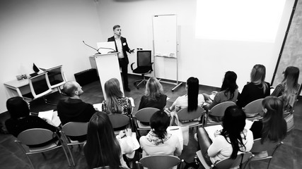 rear view.the project Manager conducts a meeting. black and white photo