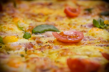 fresh tomato and greens on pizza