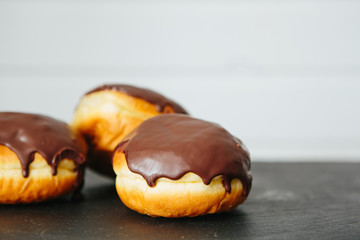 Delicious buns with raisins in a package on a light concrete table. fresh bakery. breakfast. bread. top view