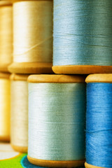 colored spools with thread