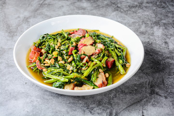 Fried water spinach with barbecued red pork