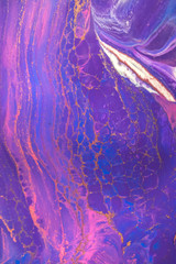 Abstract created using the technique of liquid acrylic. Macro photography of the smallest details of a picture. The picture shows how overflows of shades and colors of paint resemble space motifs.
