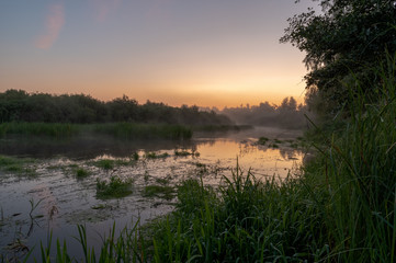 Fototapeta na wymiar Morning fog over the river. Sunrise over the river.
