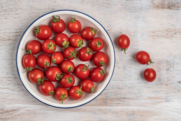 ripe cherry tomatoes on a wooden table