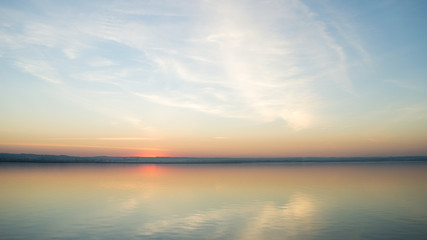 Beautiful red sunset over lake. Composition of nature.